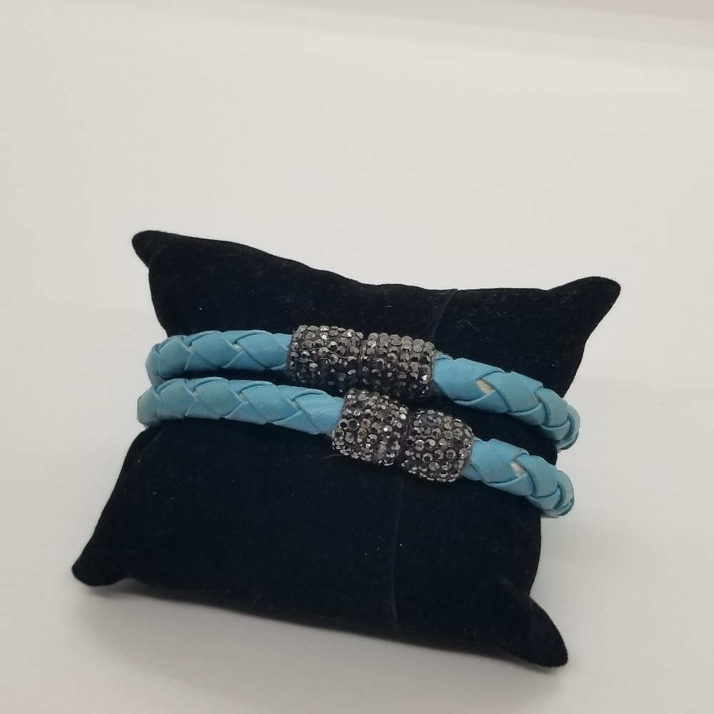 pair of faux leather braided blue bracelets